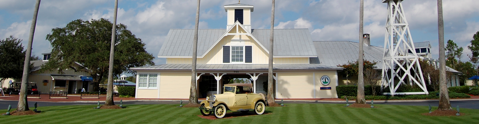 Golf course clubhouse with classic car